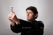 depositphotos_38446501-Priest-holding-crucifix.jpg