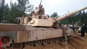 foto-adazos-asv-karaviri-trenejas-ar-abrams-tankiem-un-bradley-brunumasinam-554b0fbf31394.jpg