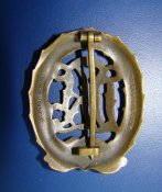 Знак DRL в бронзе