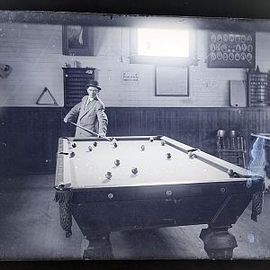 Man Playing Pool Billiards